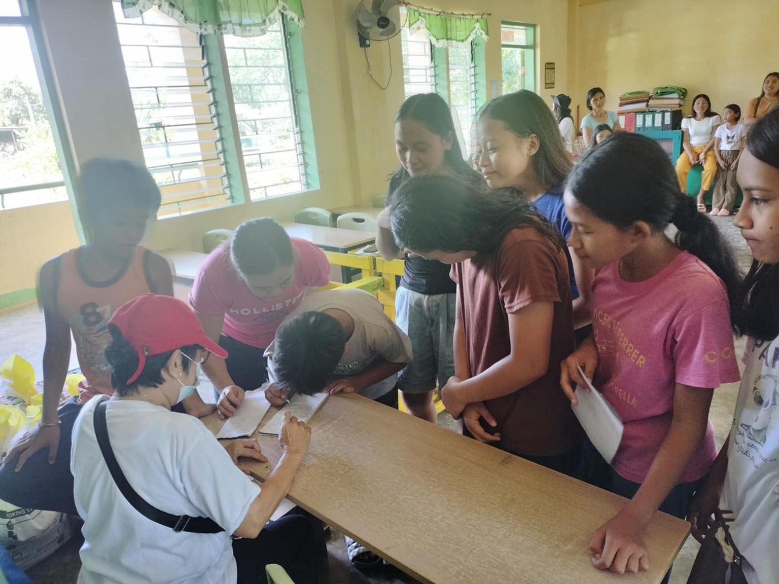 Nicolas Home Ministry volunteers with students in a classroom